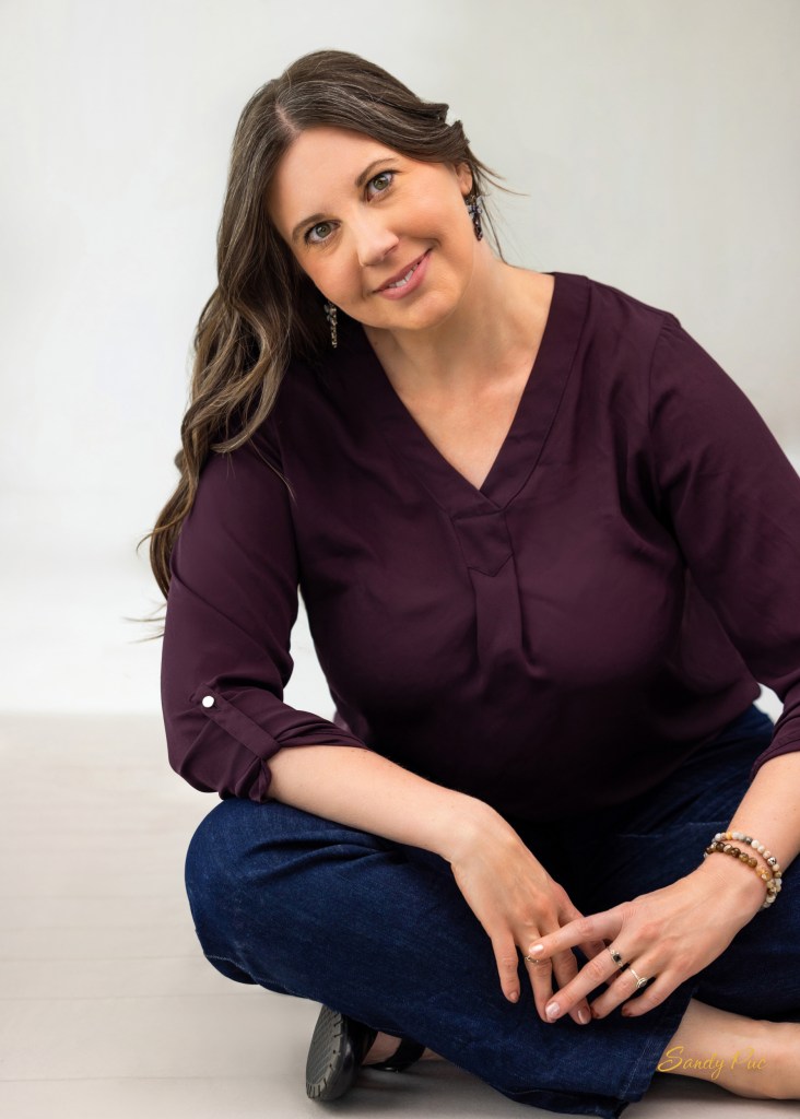 Woman seated on floor with red shirt
